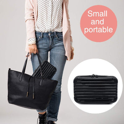Person holding a black tote bag with a small black suitcase inset, labeled 'Small and portable'.