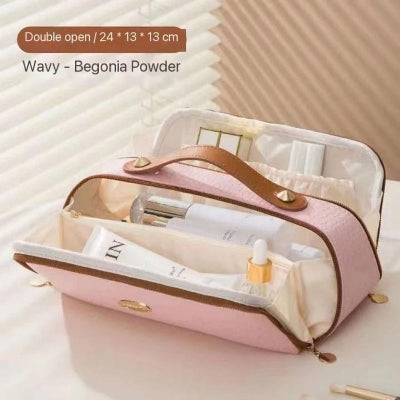 Pink cosmetic bag with skincare products on a light background